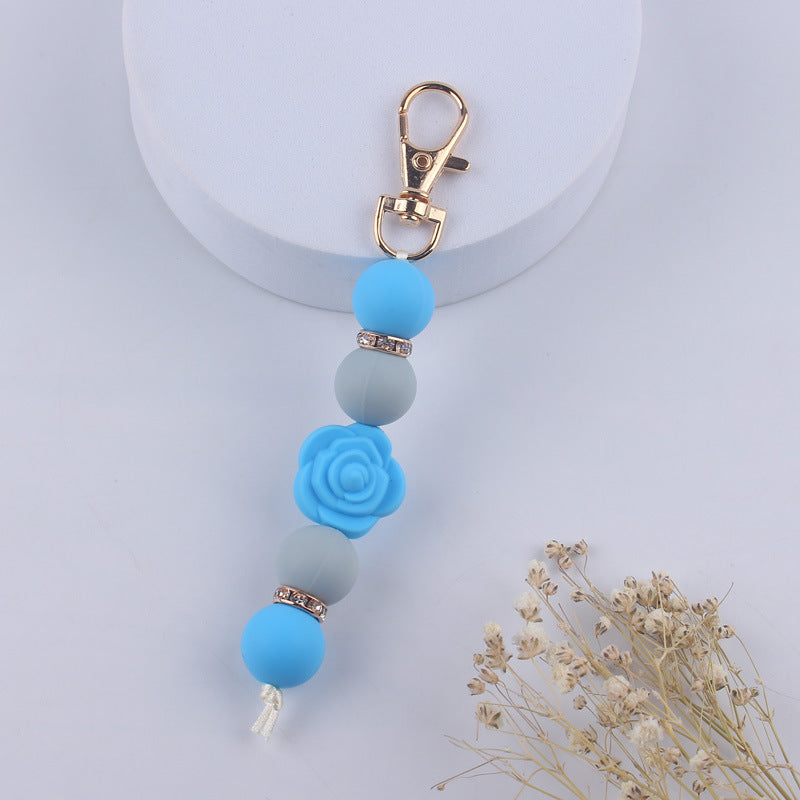 Llavero con cuentas de silicona rosa de doble cara al por mayor