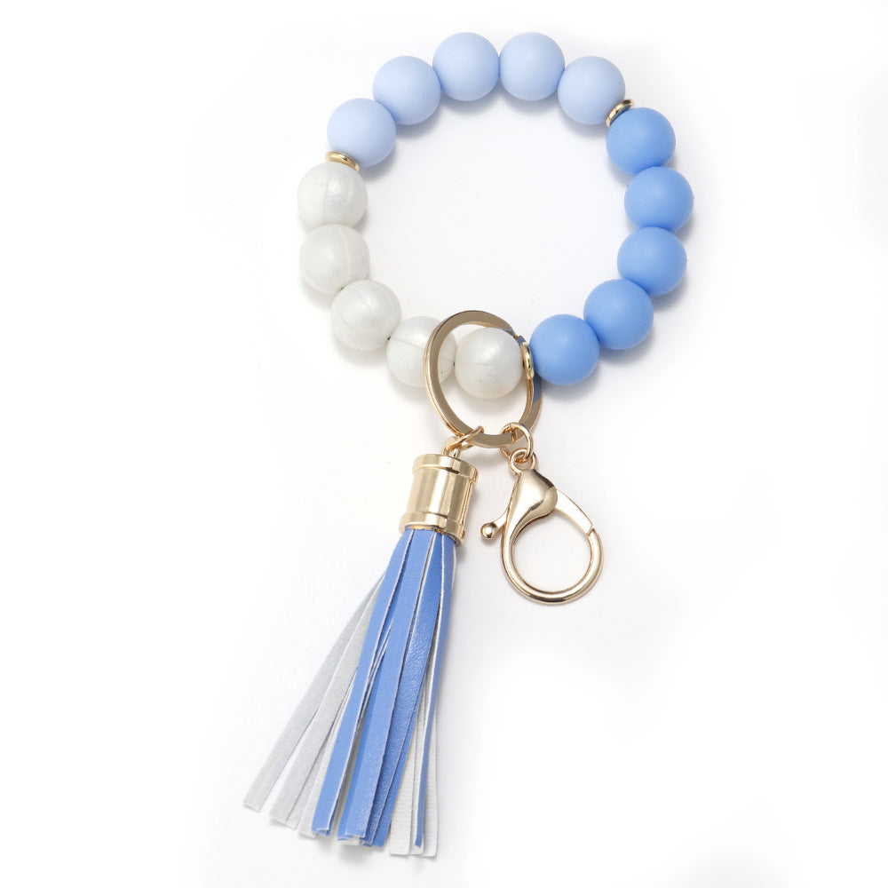 Venta al por mayor Llavero de muñeca de borla con cuentas de silicona