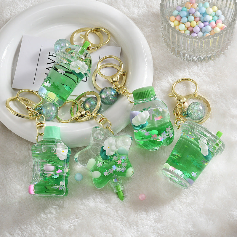 Llavero creativo de flores flotantes aceitadas de acrílico al por mayor