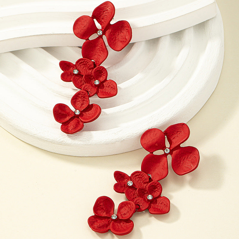 Pendientes Largos De Aleación De Pintura Metálica De Flores al por mayor