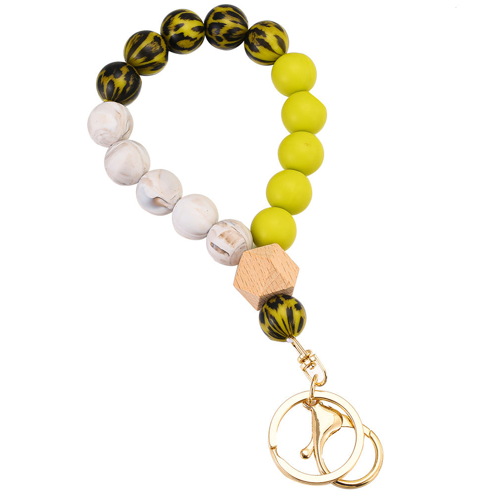 Llavero de muñeca con cuentas de madera de leopardo de leopardo.