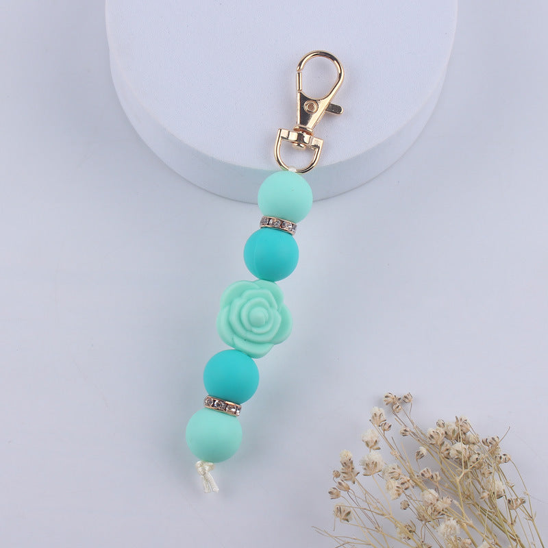 Llavero con cuentas de silicona rosa de doble cara al por mayor