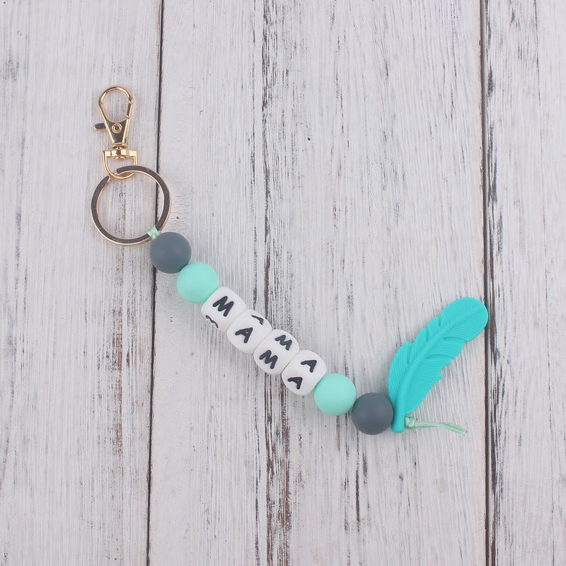 Llavero de plumas con cuentas de silicona colorida al por mayor