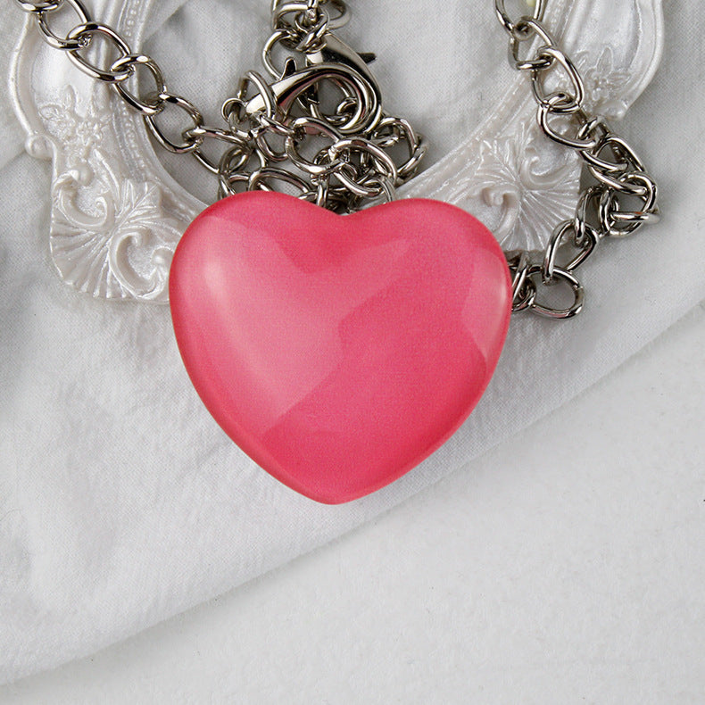 Soporte de teléfono de vidrio de corazón pequeño de melocotón al por mayor