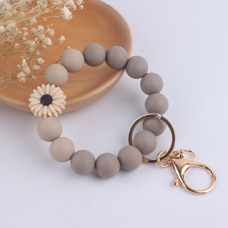 Llavero de muñeca de silicona de Pu Tassel al por mayor