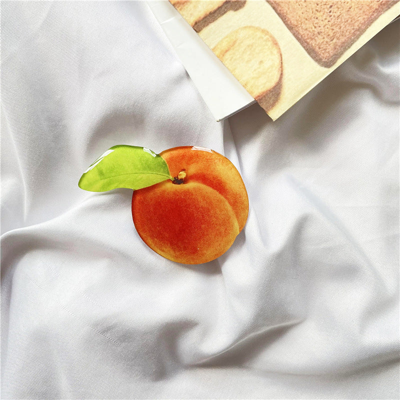 Venta al por mayor Torta de simulación Acrílico Airbag Soporte para teléfono móvil