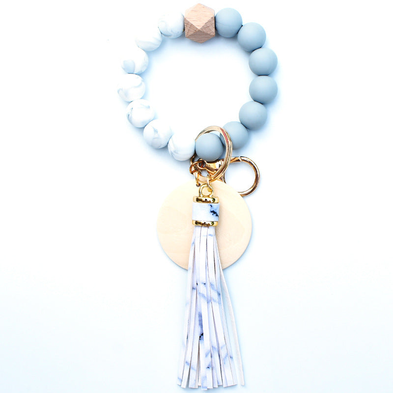 Llavero de muñeca de cuentas de madera con borla de silicona al por mayor