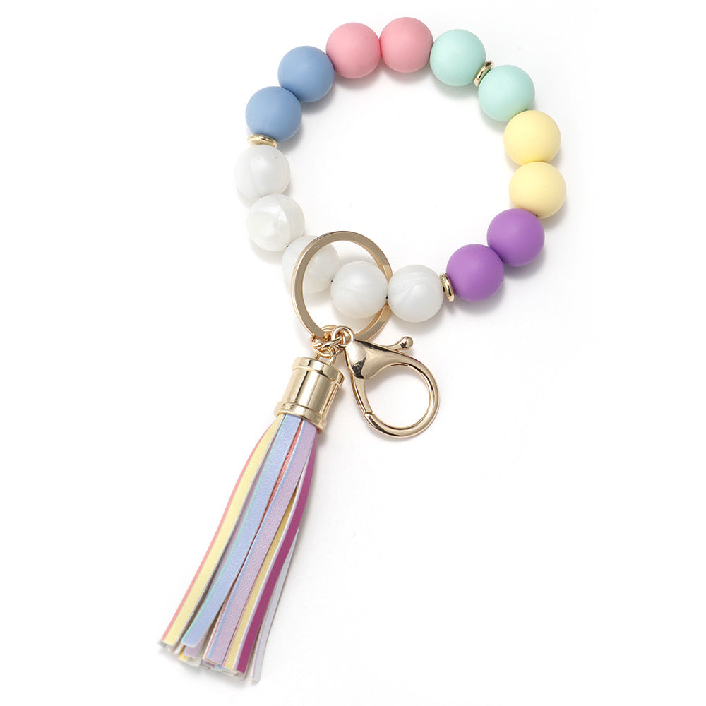 Venta al por mayor Llavero de muñeca de borla con cuentas de silicona