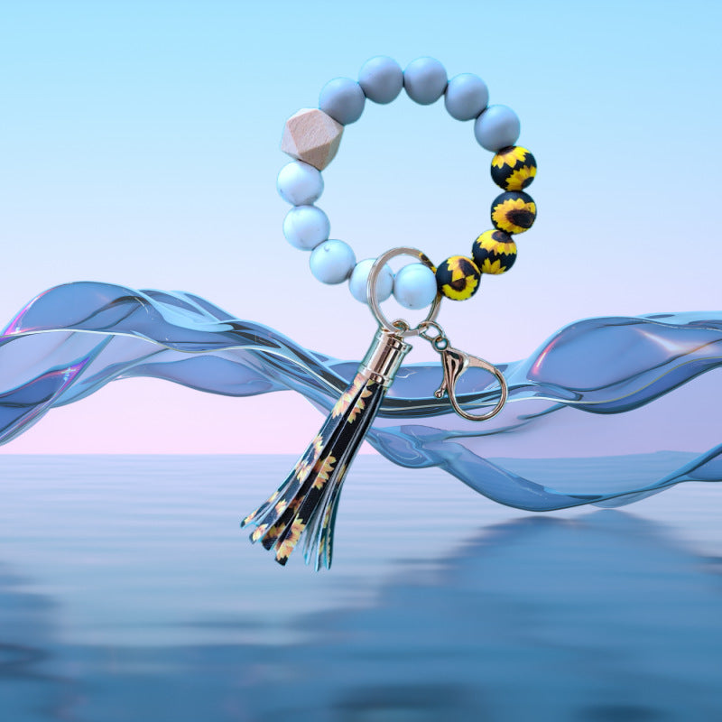 Venta al por mayor Llavero de muñeca con cuentas de silicona de girasol