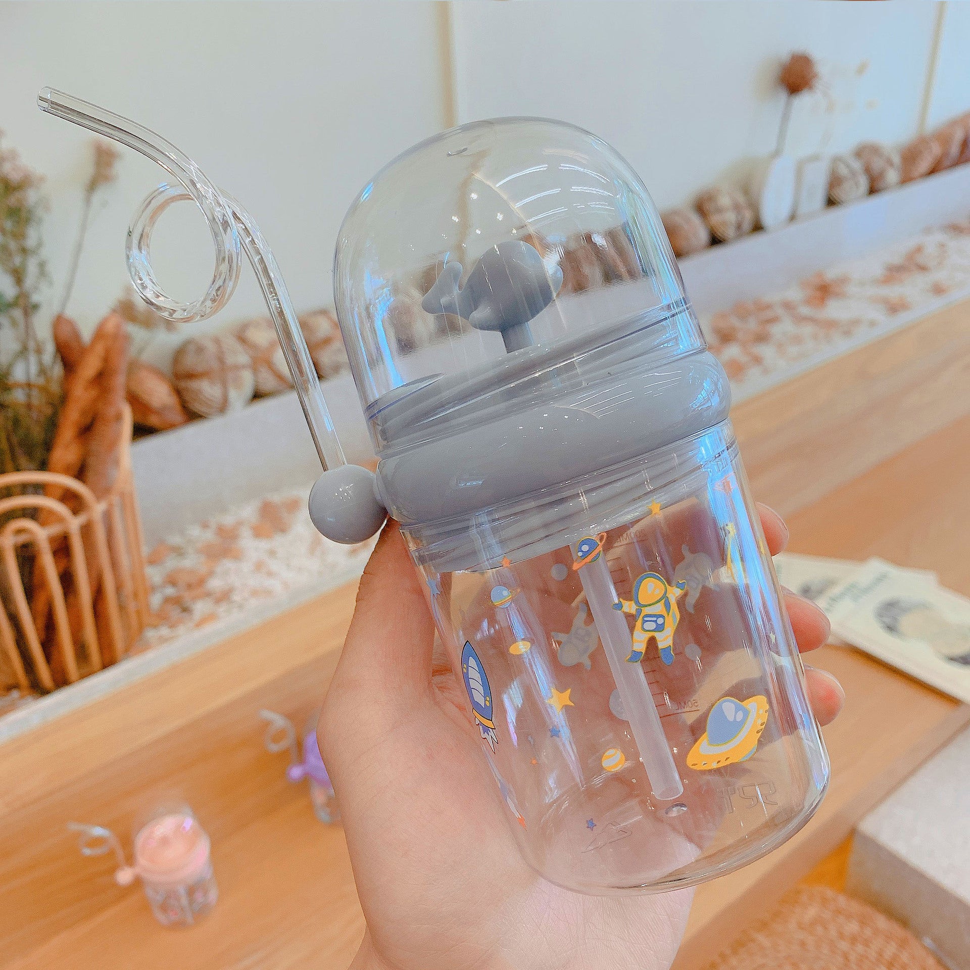Wholesale Water spray whale cup children's portable anti-fall plastic cup with scale windmill