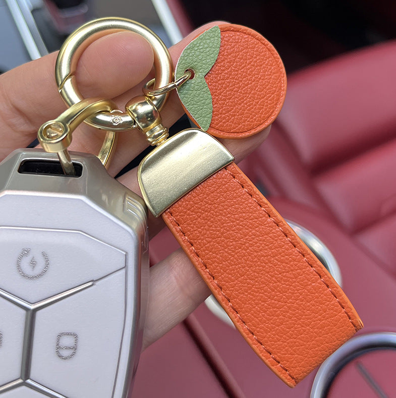 Venta al por mayor Llavero de cordón de fresa de cuero de vaca