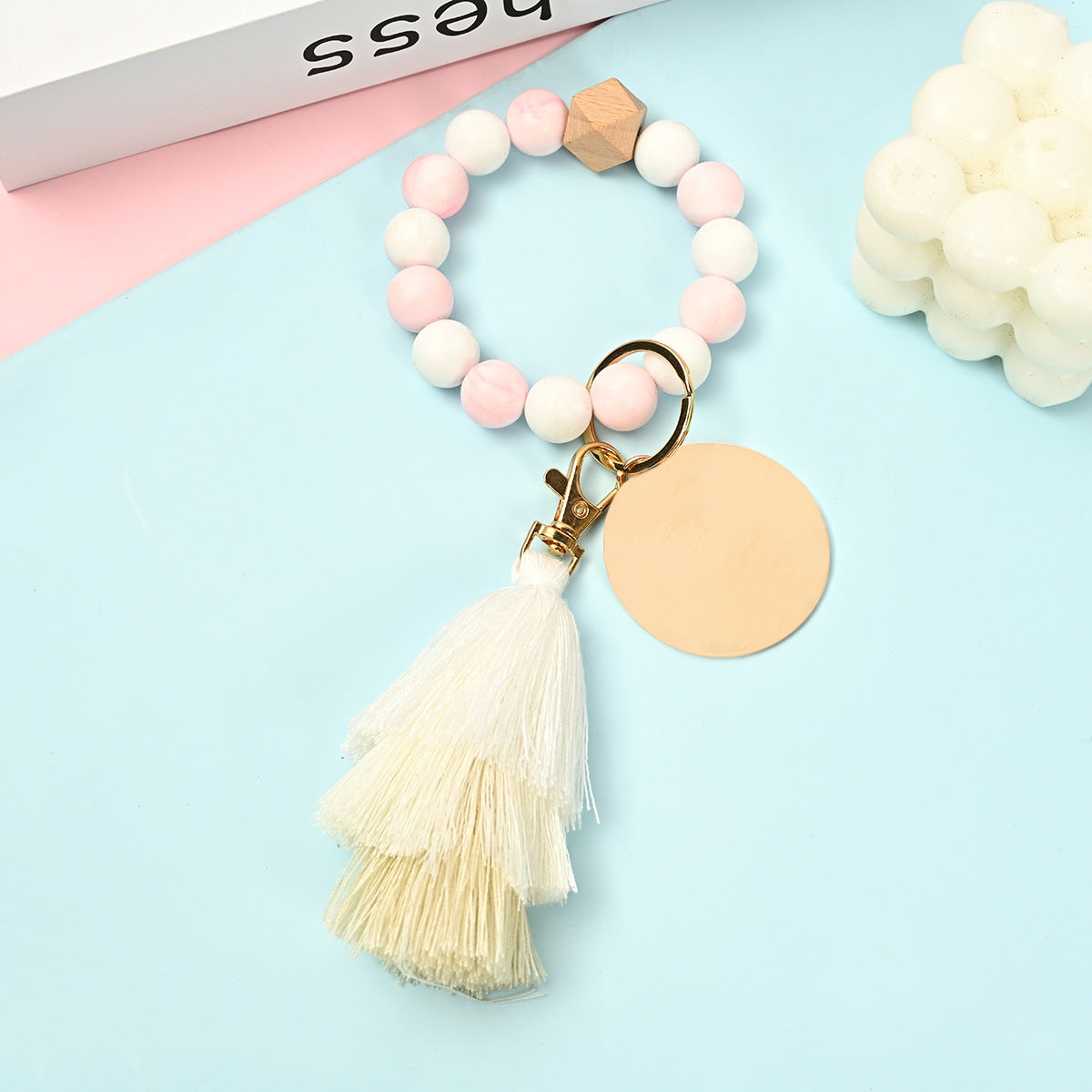 Venta al por mayor Llavero de la pulsera del grano del silicón de la borla