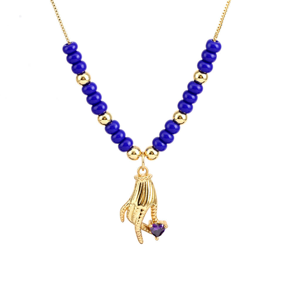 Collar con colgante de ojo mágico en forma de corazón de cobre al por mayor