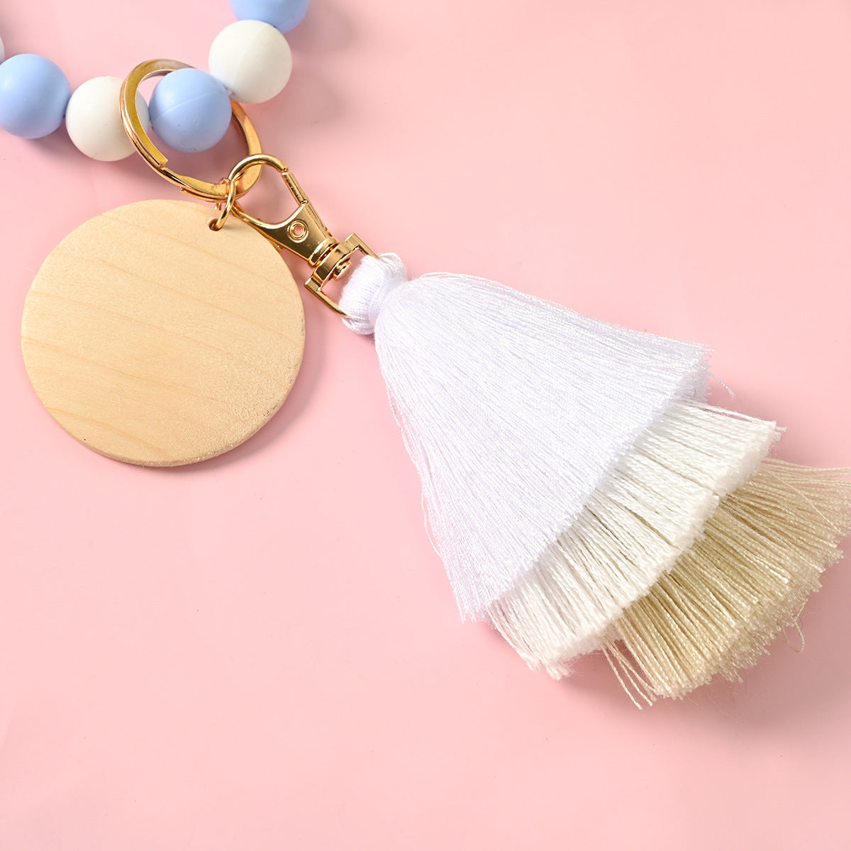 Venta al por mayor Llavero de la pulsera del grano del silicón de la borla