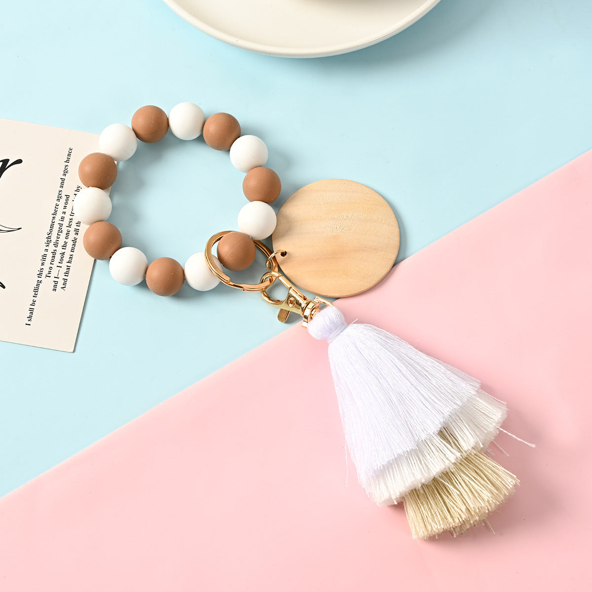 Venta al por mayor Llavero de la pulsera del grano del silicón de la borla