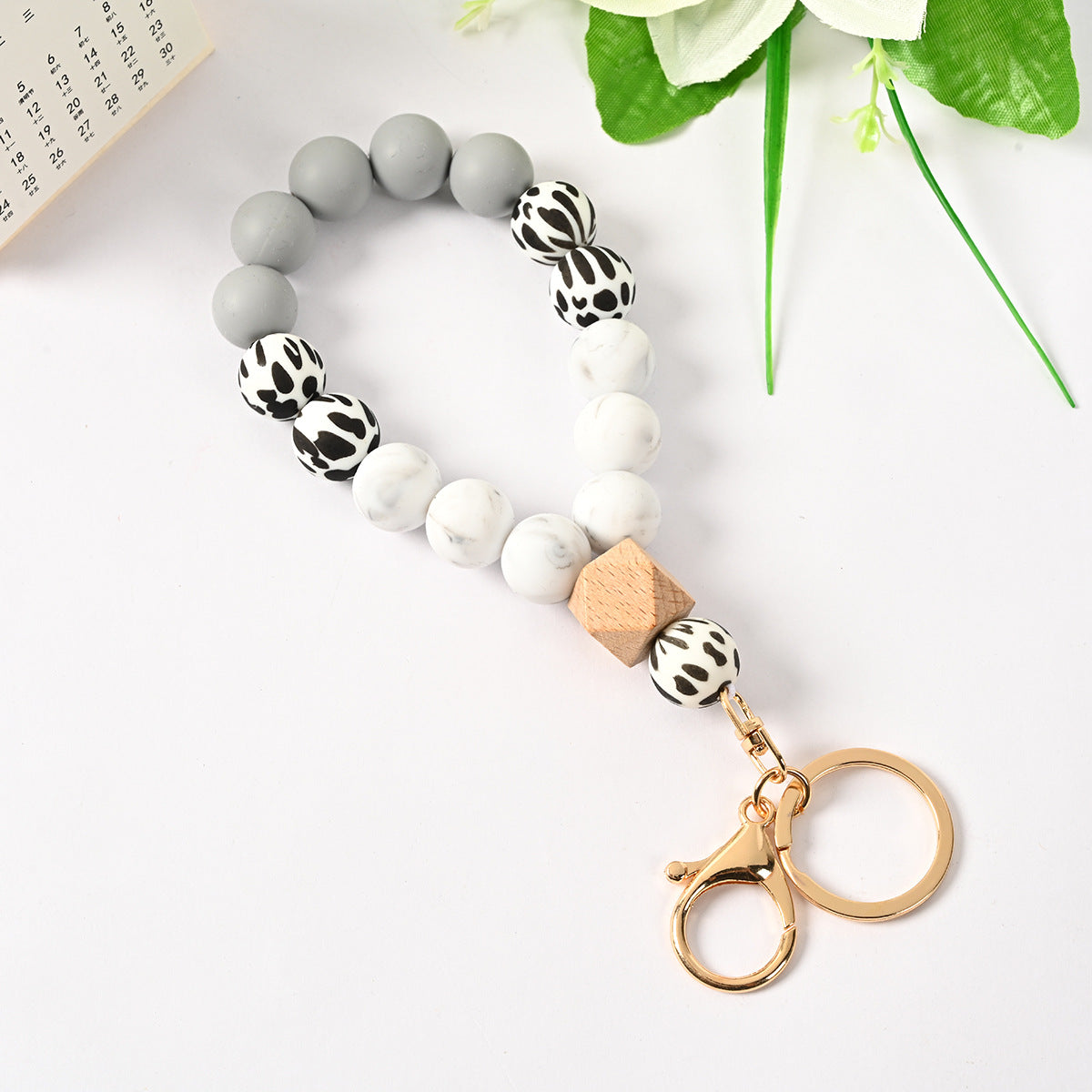 Venta al por mayor Llavero de la pulsera del grano del silicón de la borla