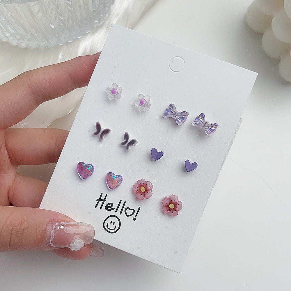 Venta al por mayor Conjunto de pendientes de aleación con forma de corazón y mariposa