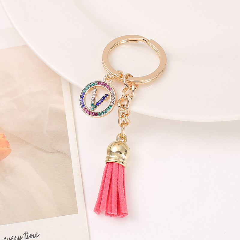 Venta al por mayor Llavero del alfabeto inglés de la borla de la aleación del cinc