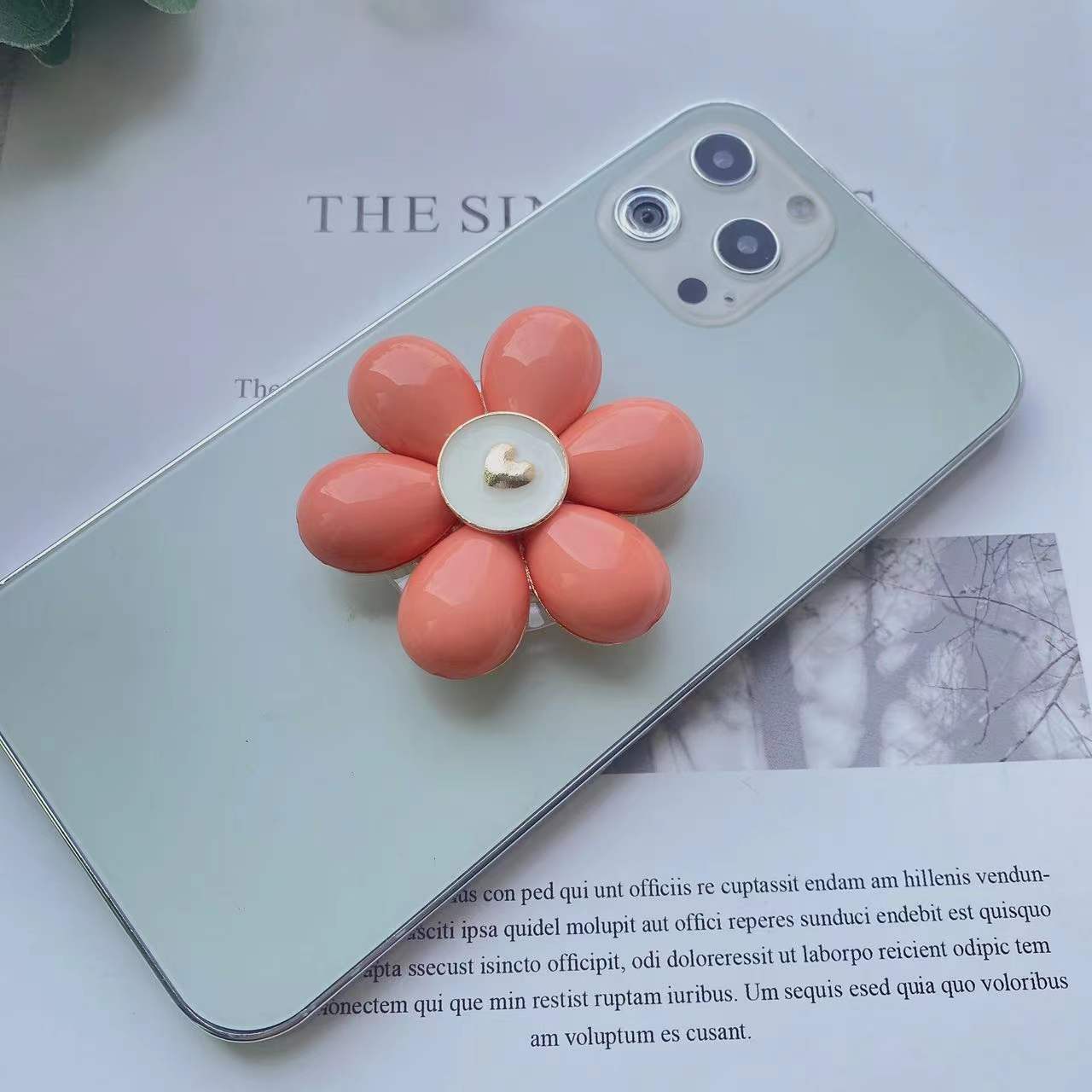 Soporte de teléfono móvil plegable Camellia de resina al por mayor