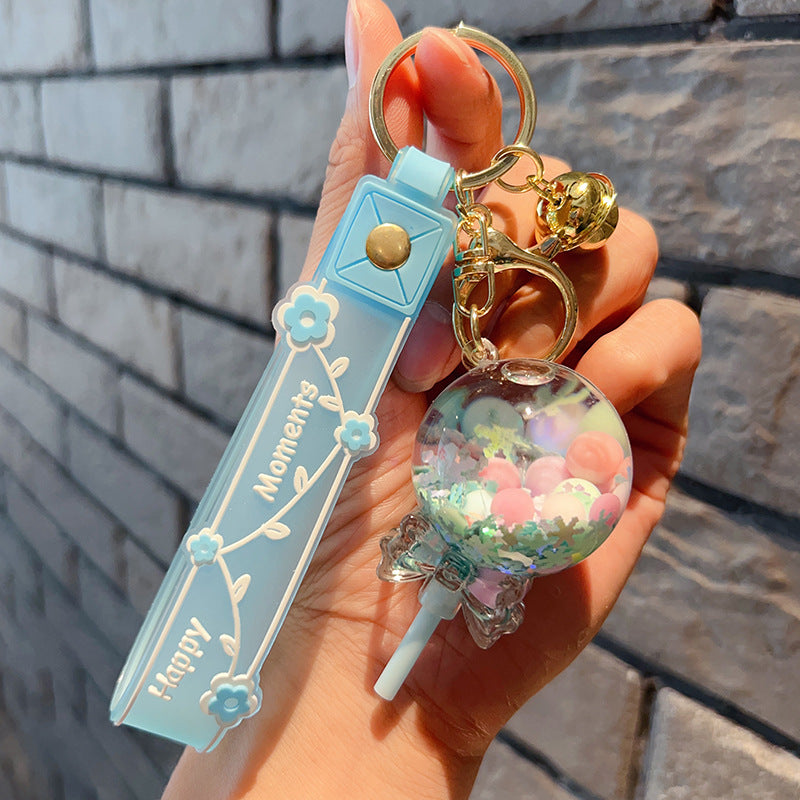 Piruleta de acrílico al por mayor en el llavero creativo de la arena movediza del aceite