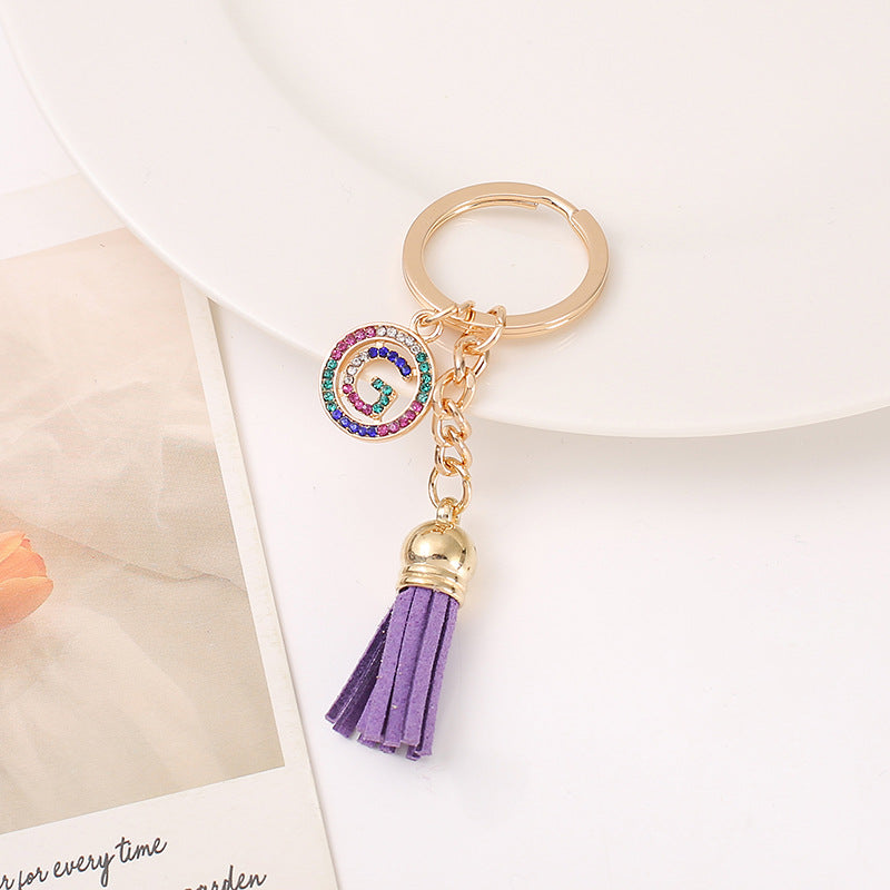 Venta al por mayor Llavero del alfabeto inglés de la borla de la aleación del cinc