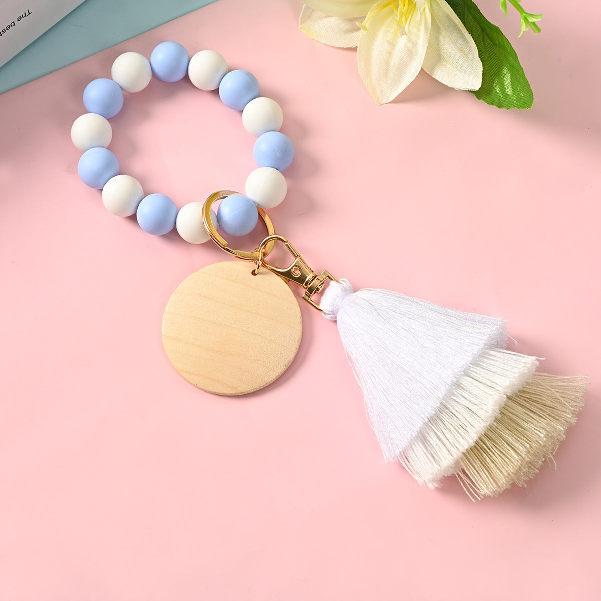 Venta al por mayor Llavero de la pulsera del grano del silicón de la borla