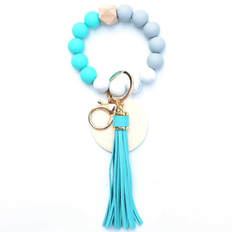 Llavero de muñeca de cuentas de madera con borla de silicona al por mayor