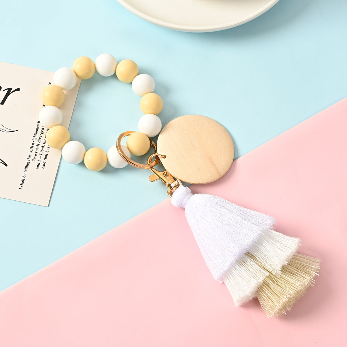 Venta al por mayor Llavero de la pulsera del grano del silicón de la borla