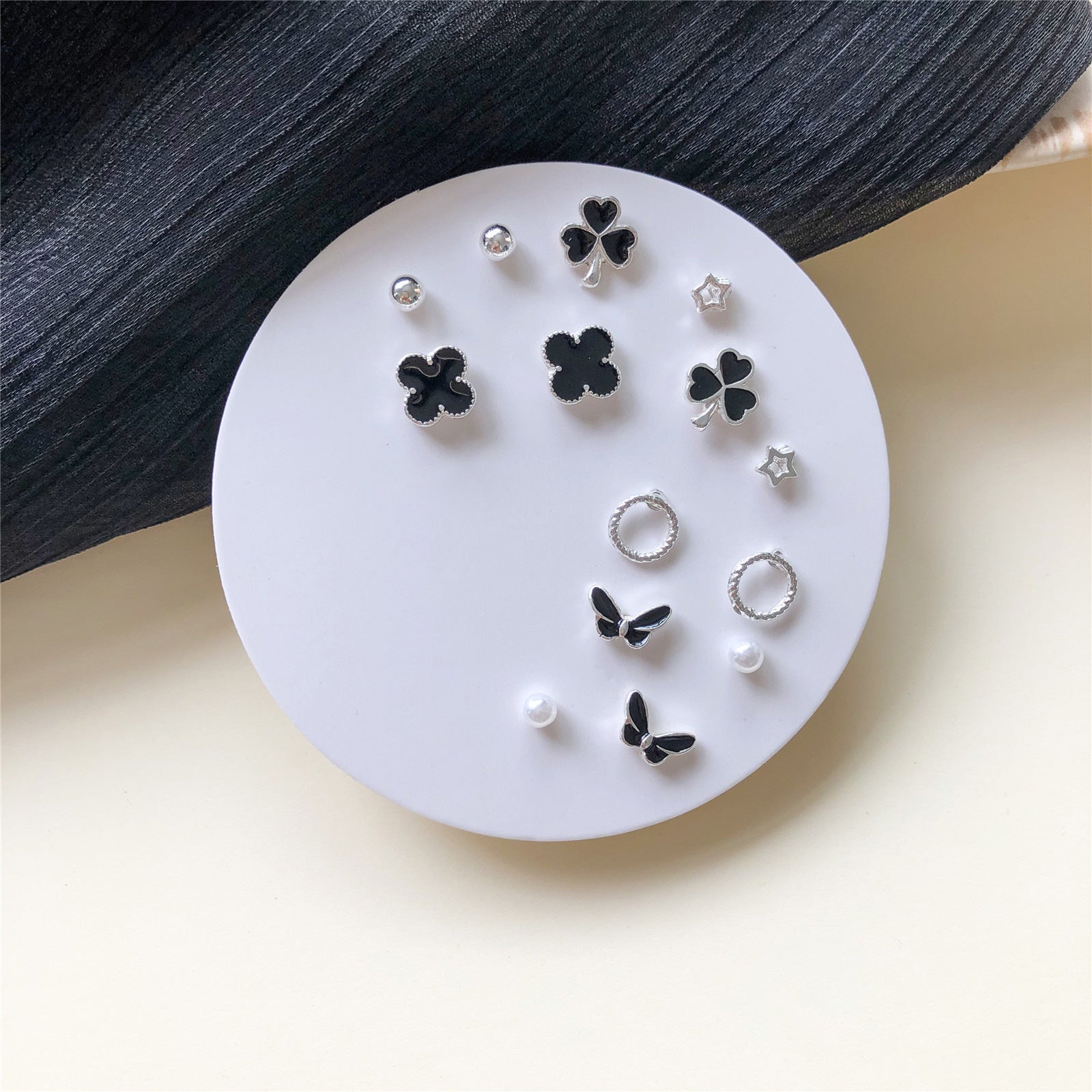 Venta al por mayor Conjunto de aretes de una semana Aretes de aleación