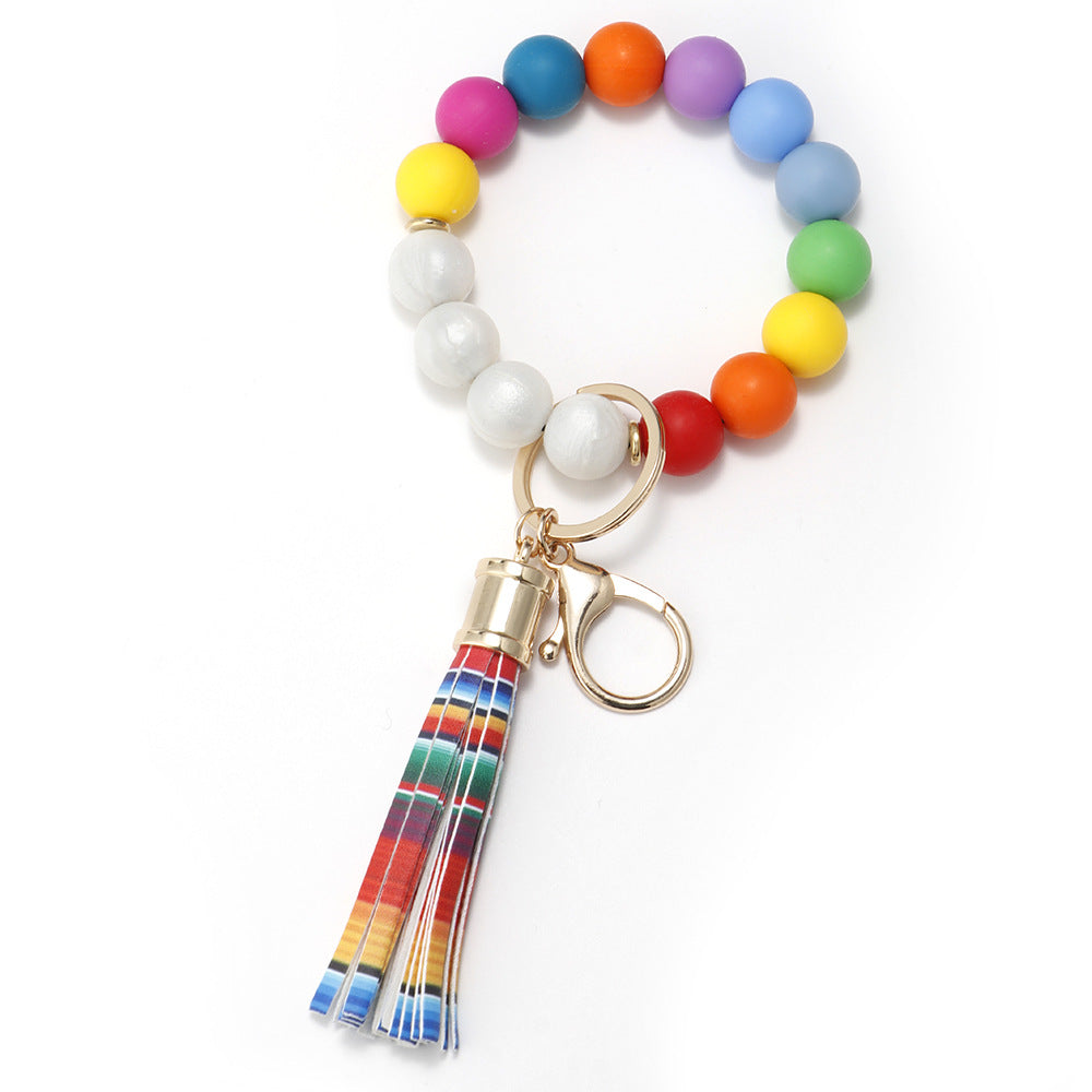 Venta al por mayor Llavero de muñeca de borla con cuentas de silicona