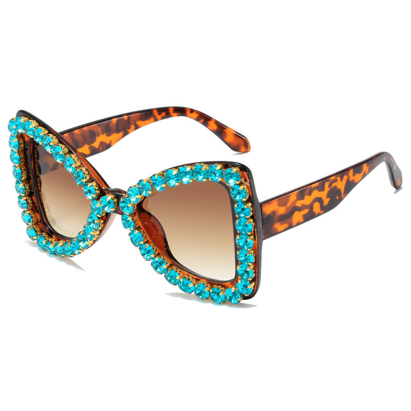 Venta al por mayor de marco grande Bowknot diamante PC gafas de sol