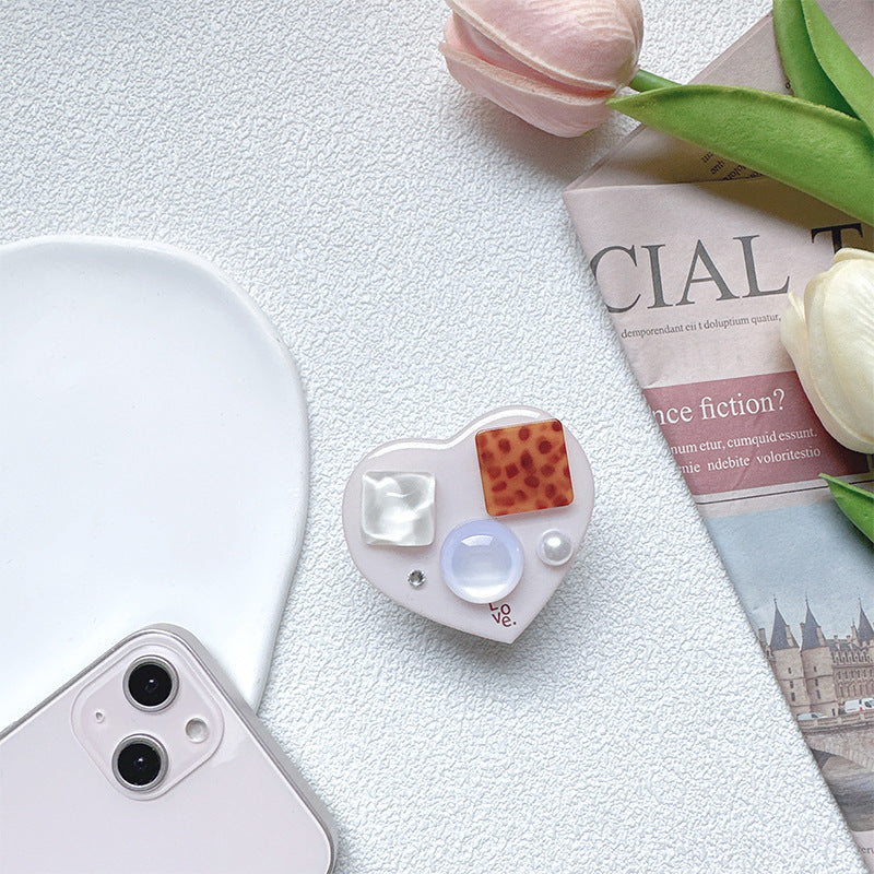 Soporte para teléfono móvil con bolsa de aire de amor de gema de plástico al por mayor