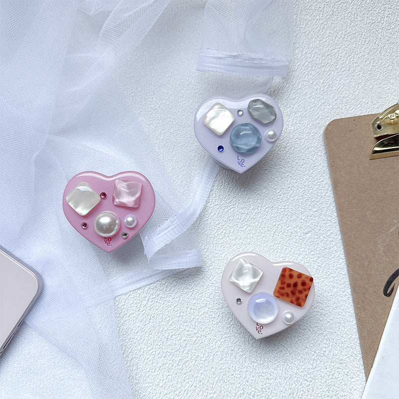 Soporte para teléfono móvil con bolsa de aire de amor de gema de plástico al por mayor