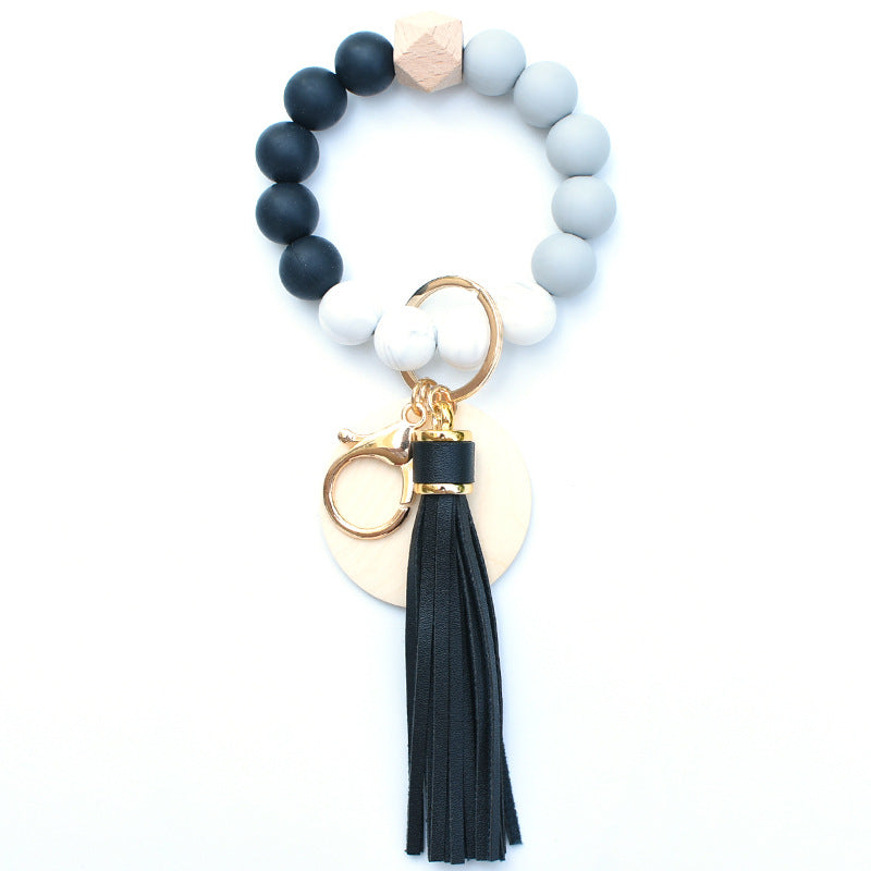 Llavero de muñeca de cuentas de madera con borla de silicona al por mayor