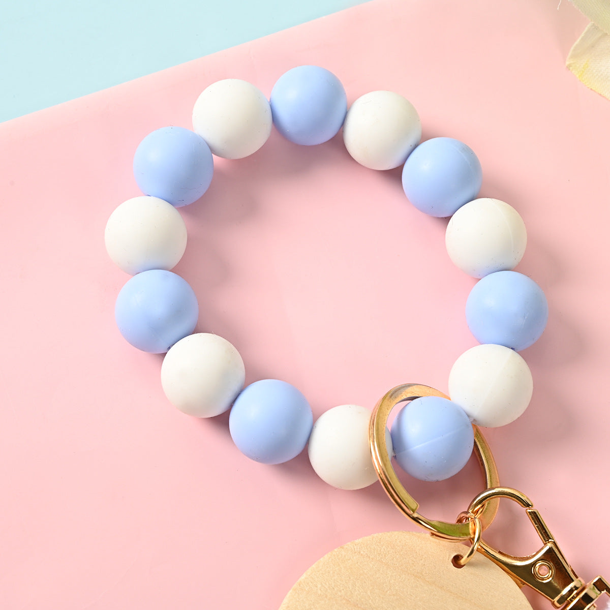 Venta al por mayor Llavero de la pulsera del grano del silicón de la borla