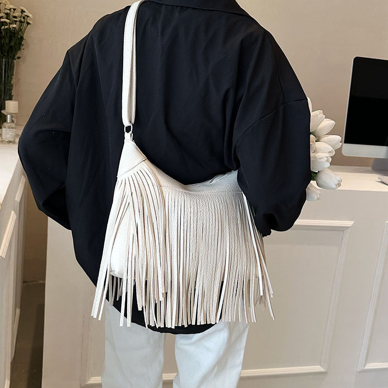 Venta al por mayor Bolso de cubo diagonal con borla de PU