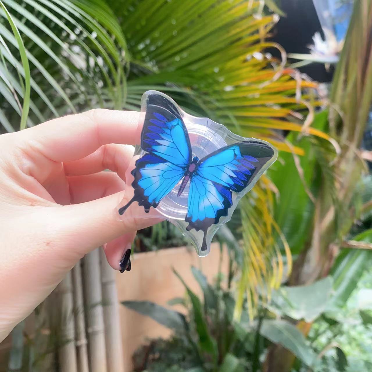 Venta al por mayor Soporte de teléfono móvil de mariposa pintada de acrílico
