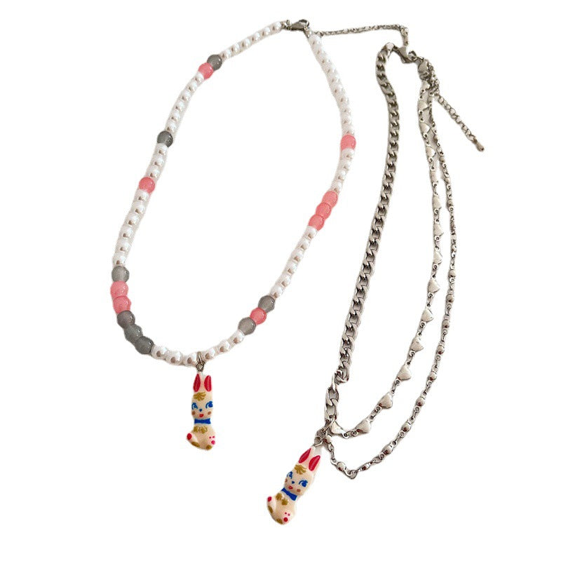 Venta al por mayor Pearl Bunny Collares De Acero De Titanio