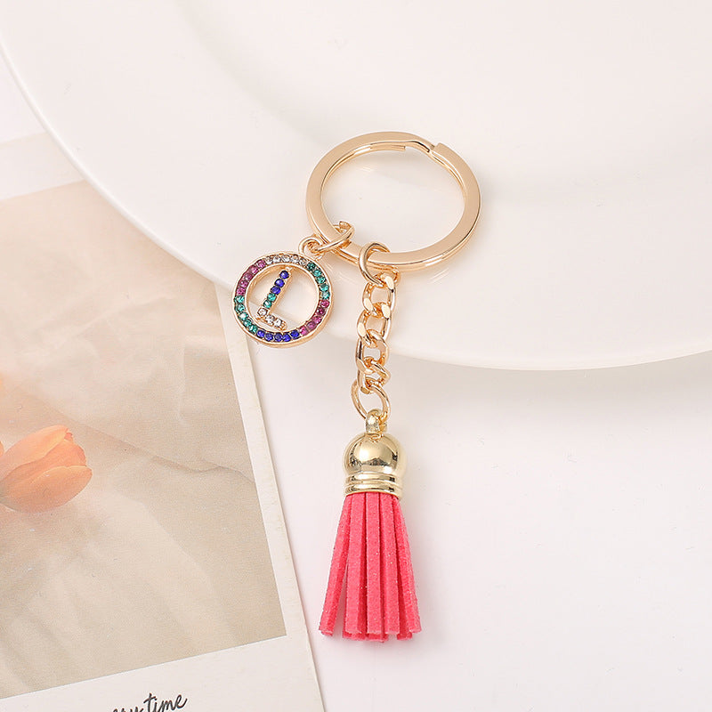 Venta al por mayor Llavero del alfabeto inglés de la borla de la aleación del cinc