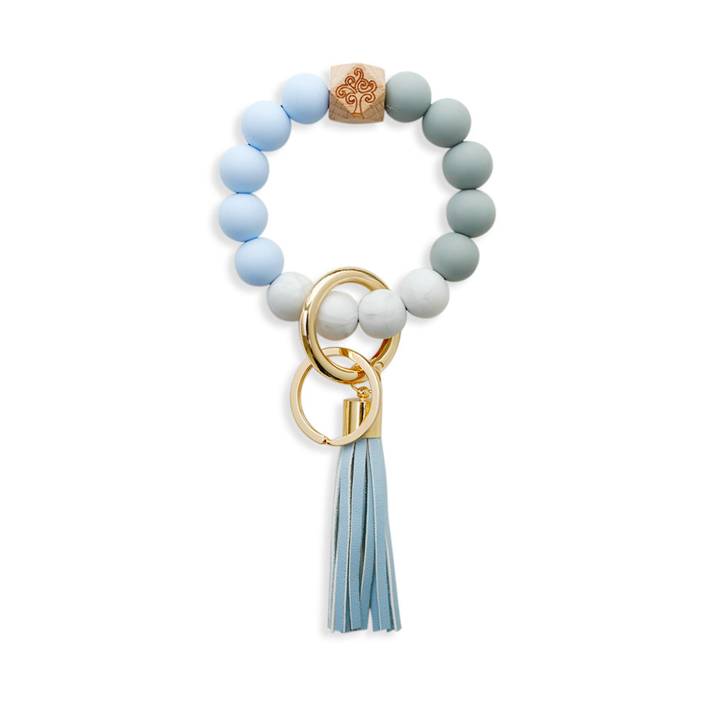 Comercio al por mayor borla de cuero colgante de cuentas de silicona llavero de muñeca