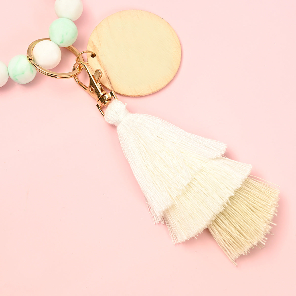 Venta al por mayor Llavero de la pulsera del grano del silicón de la borla