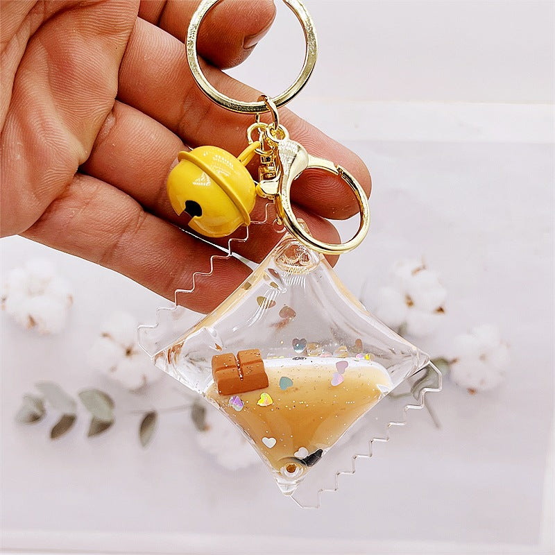 Comercio al por mayor acrílico flotando en el aceite de chocolate arenas movedizas llavero creativo