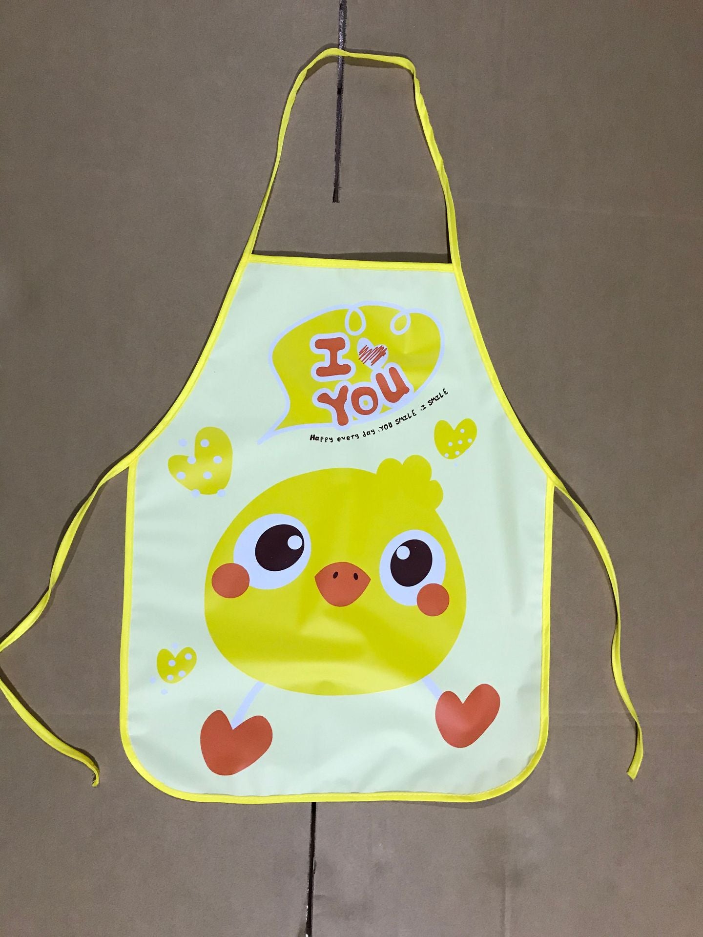 Delantal impermeable al por mayor de los niños de la historieta del PE