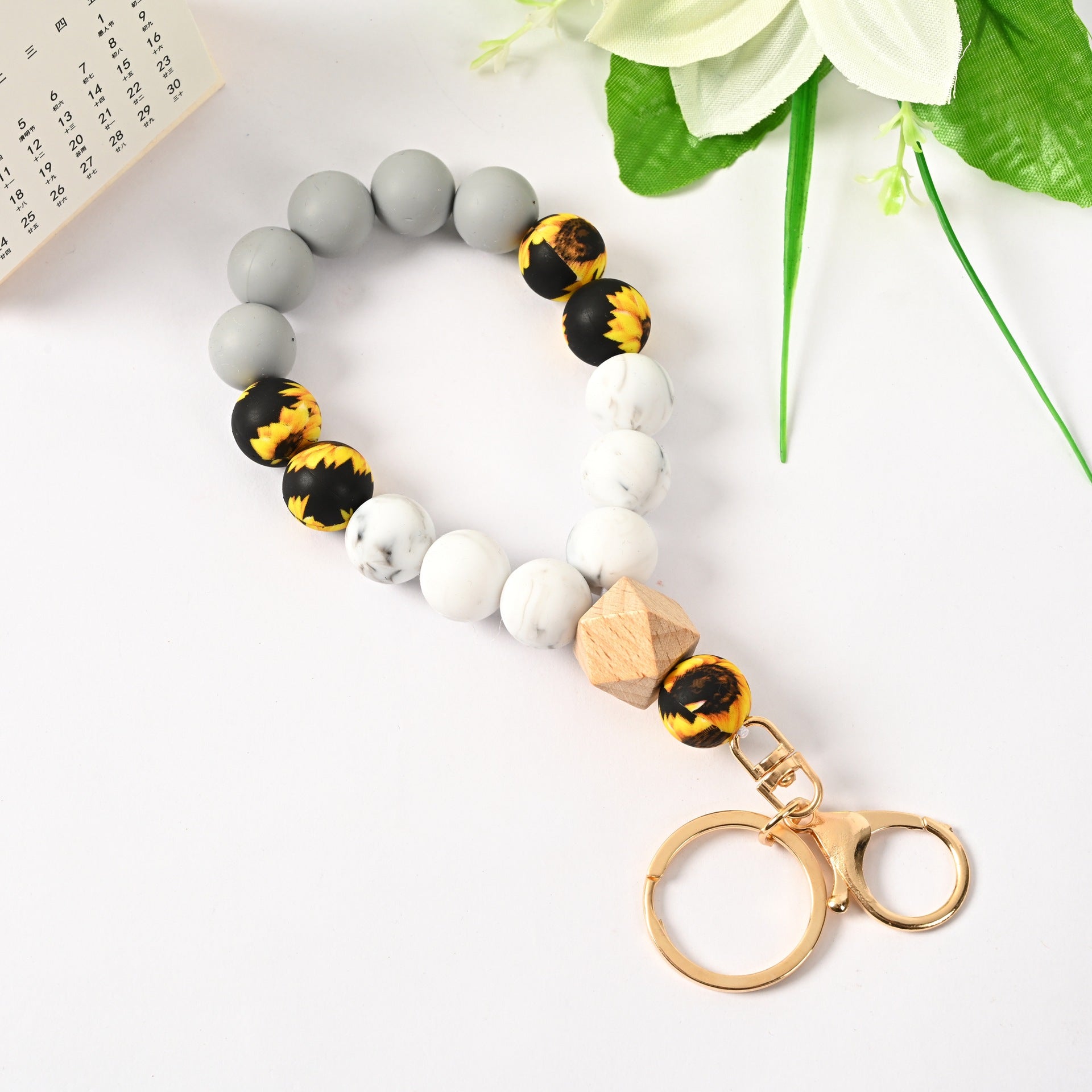 Venta al por mayor Llavero de la pulsera del grano del silicón de la borla