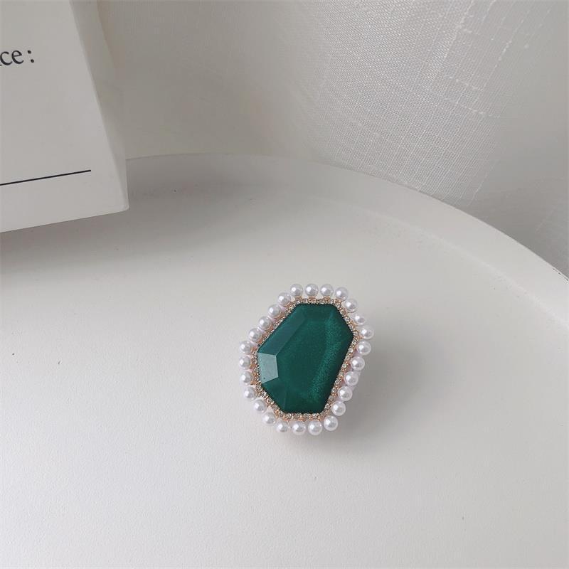 Venta al por mayor Soporte para teléfono móvil de perlas de piedras preciosas