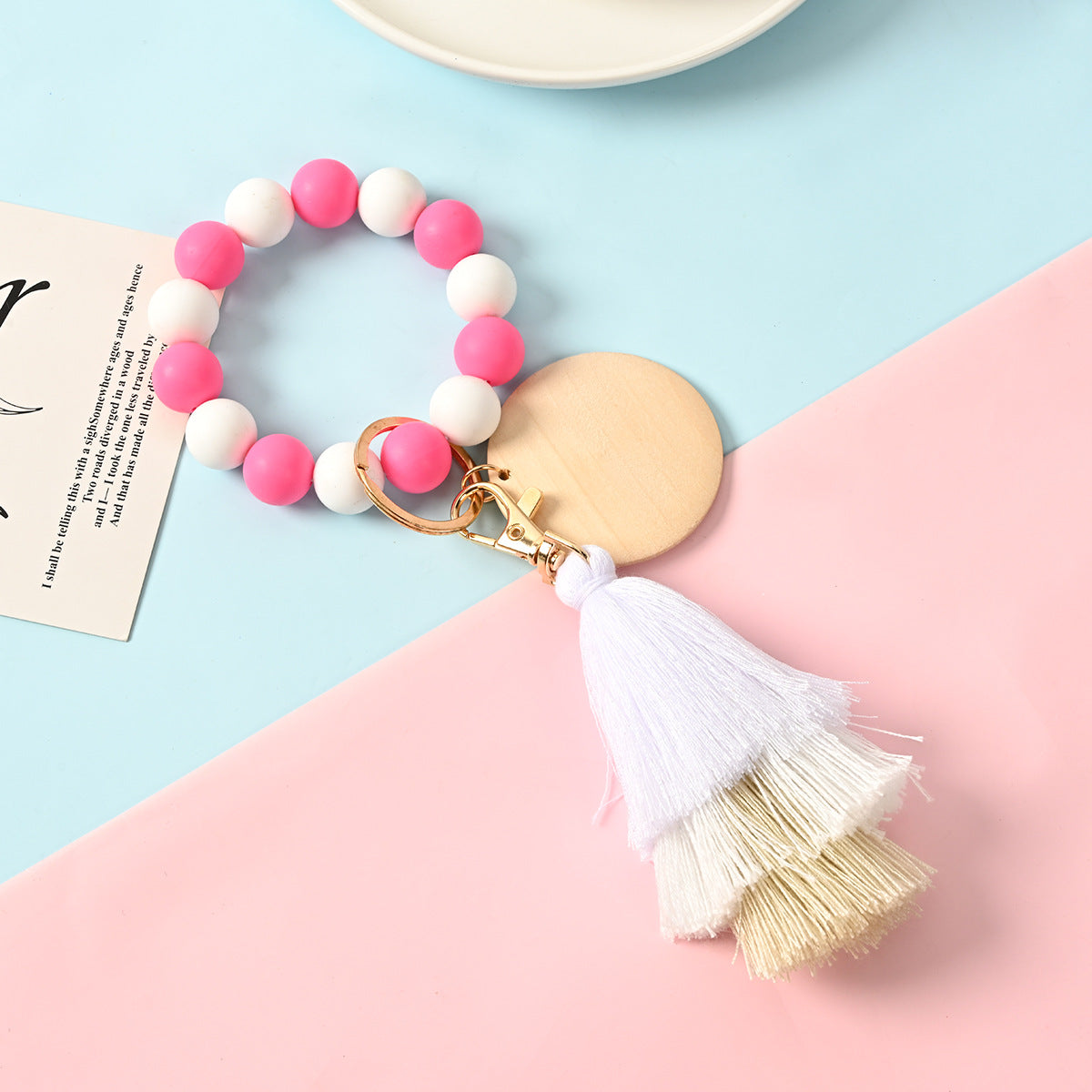 Venta al por mayor Llavero de la pulsera del grano del silicón de la borla