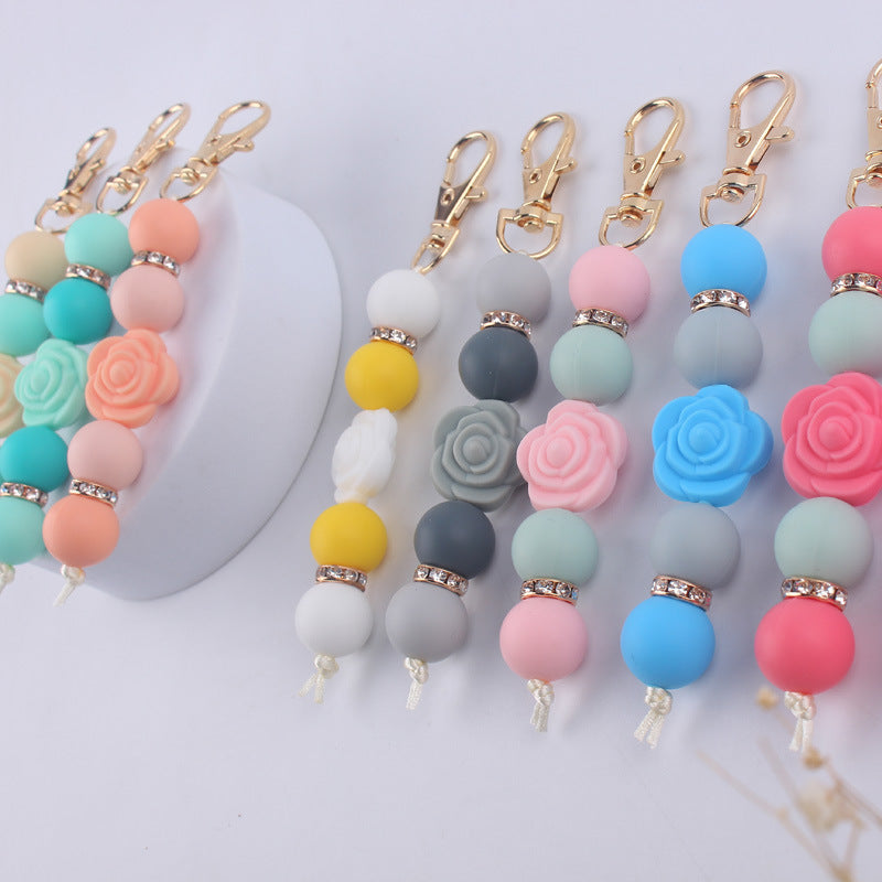 Llavero con cuentas de silicona rosa de doble cara al por mayor