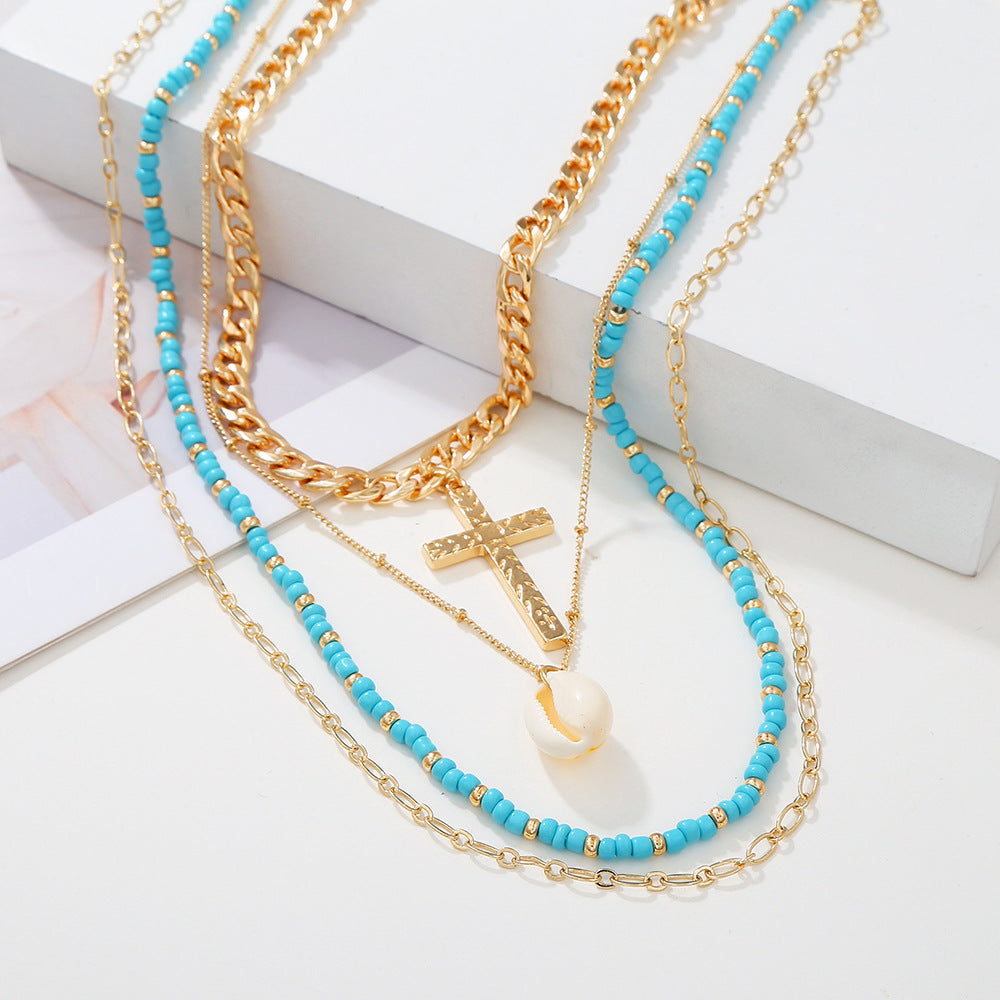 Venta al por mayor collar de cruz de concha de cuentas demi multicapa