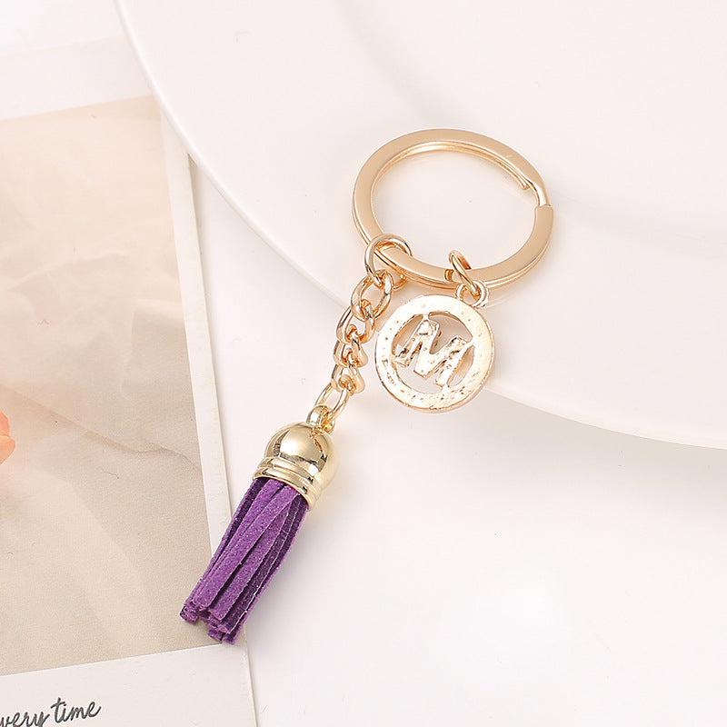 Venta al por mayor Llavero del alfabeto inglés de la borla de la aleación del cinc