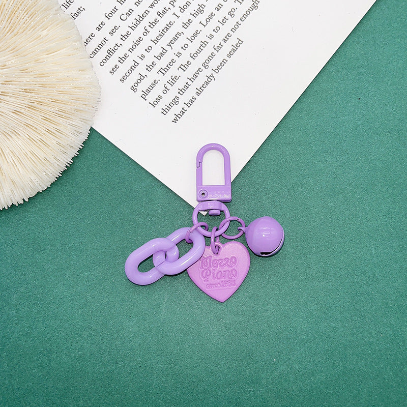 Venta al por mayor Llaveros de acrílico de campana pequeña de corazón de color caramelo